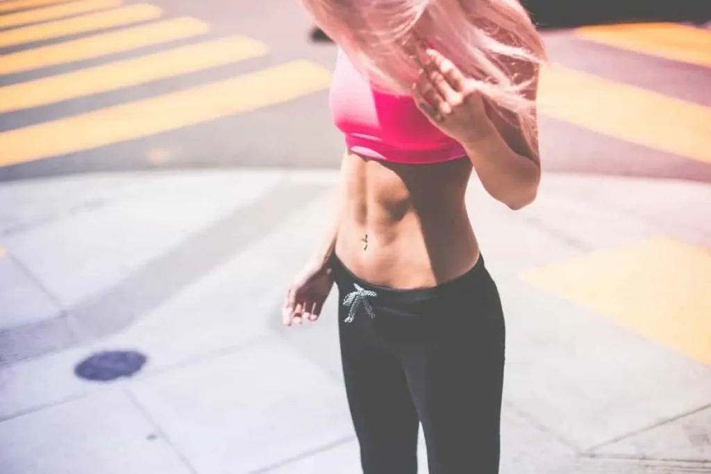 Woman with toned stomach after LA-EMS Body Sculpting Treatment Acton